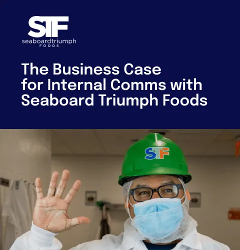 Worker in a green hard hat and mask waves in a food processing facility. Text reads: "The Business Case for Internal Comms with Seaboard Triumph Foods."