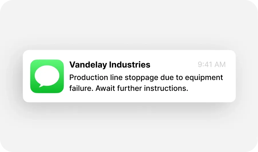 Text message notification from Vandelay Industries about a production line stoppage due to equipment failure, sent at 9:41 AM.