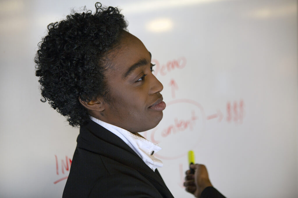nonbinary person giving presentation at work Vice HQ2470 1024x682 jpeg