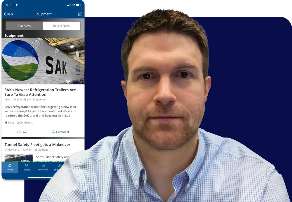 Man in a checkered shirt in front of a digital background displaying a mobile app with news about SAK's refrigeration trailers.