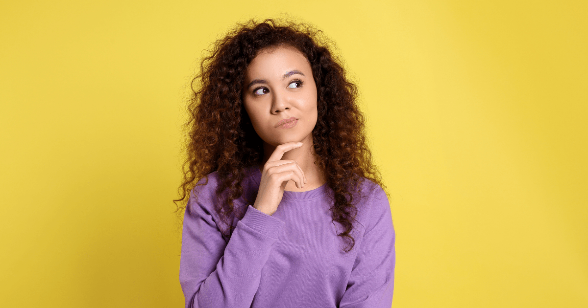 woman touching chin in thinking pose