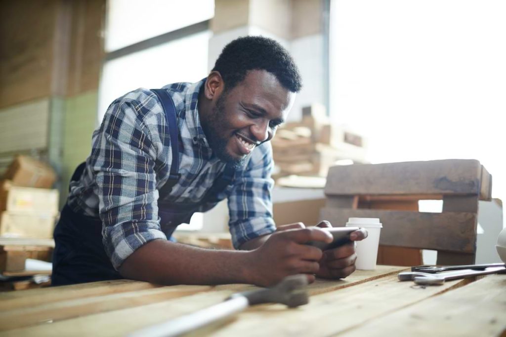 A worker checking his employee communication app.