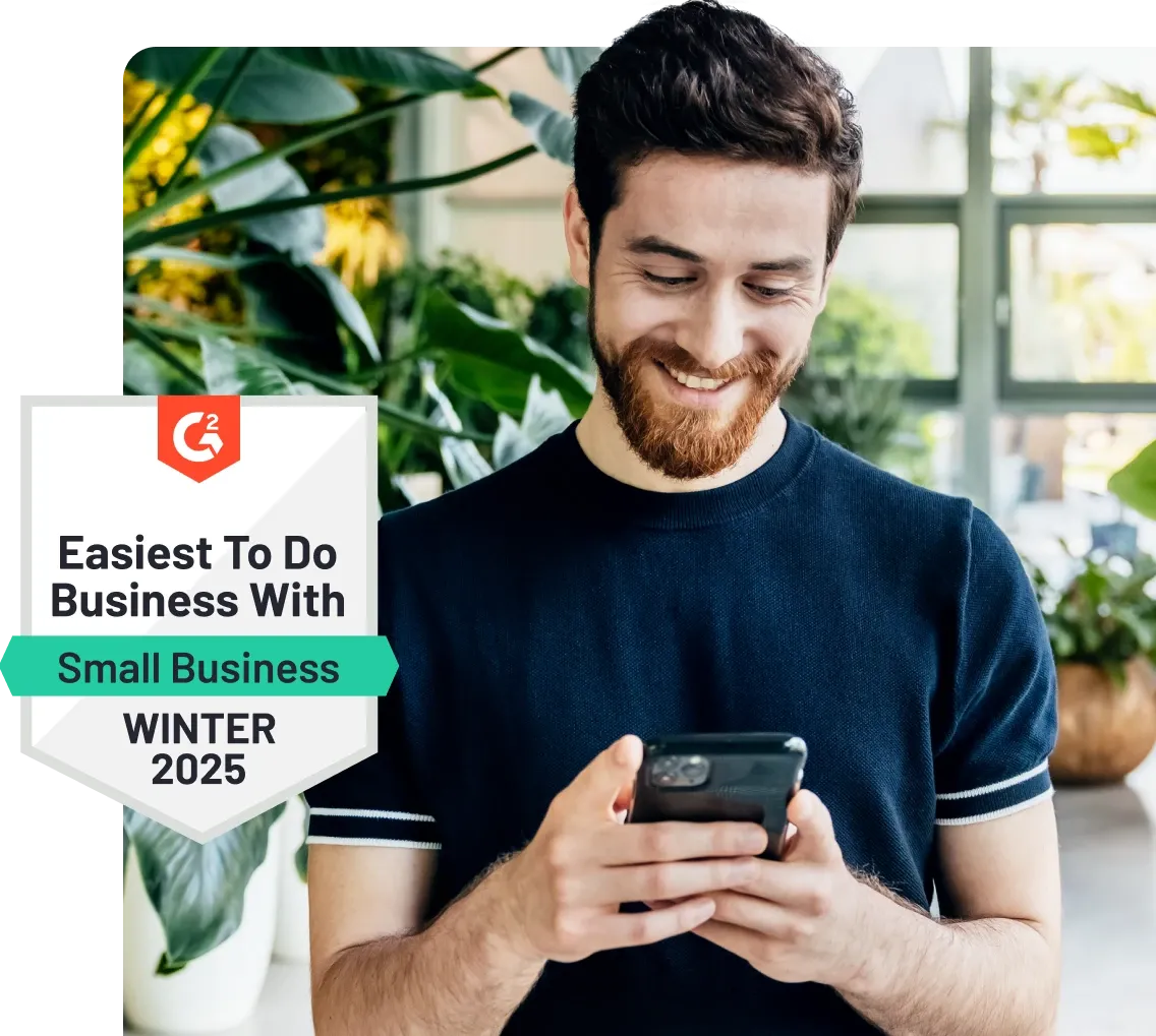 Man smiling at phone, standing near plants. Badge reads "Easiest To Do Business With, Small Business, Winter 2025."