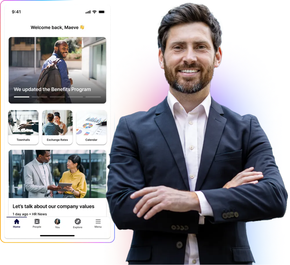 Smiling man in a suit stands with arms crossed beside a smartphone displaying a company app interface.