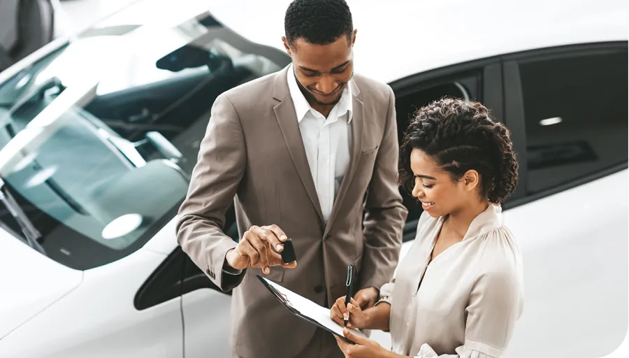 Signing a contract in the car sales room