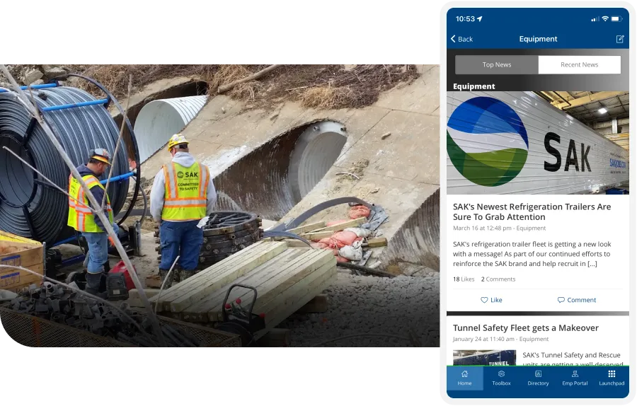SAK Construction workers in safety vests install large cables near concrete pipes; a smartphone displays related company news.