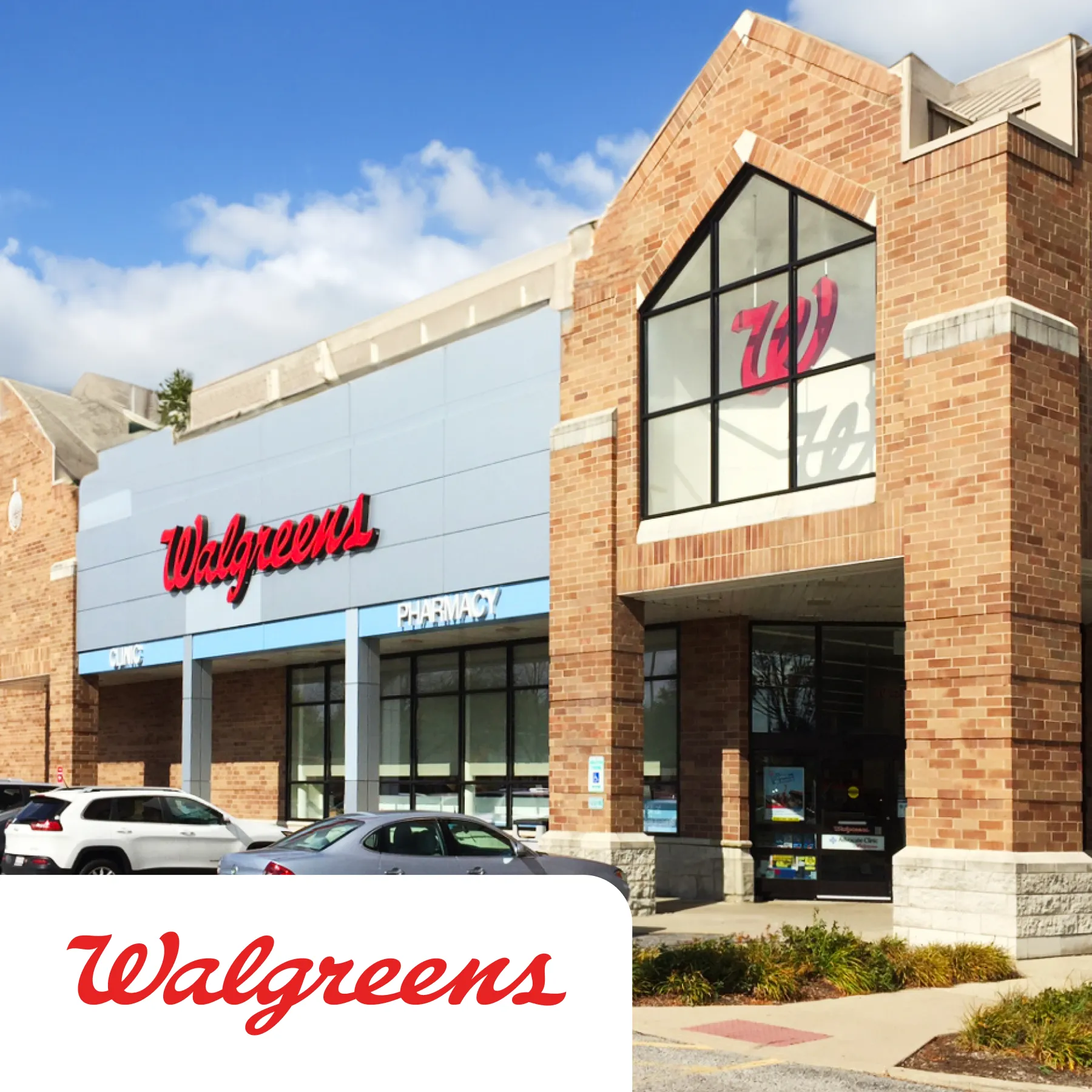 Exterior of a Walgreens store with brick facade and large windows. Several cars are parked in front. Walgreens logo is visible.
