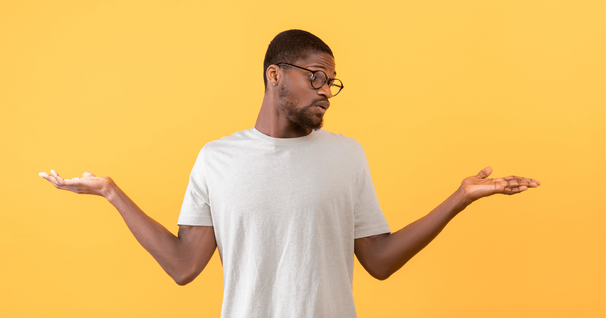 Man has confused expression and hands up