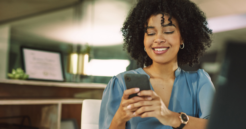 image of woman smiling on phone