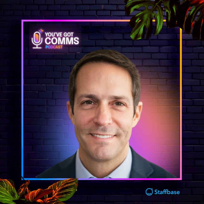 A man smiling in a colorful portrait