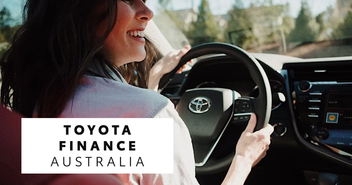 Person smiling while driving a Toyota car, with "Toyota Finance Australia" text overlay.