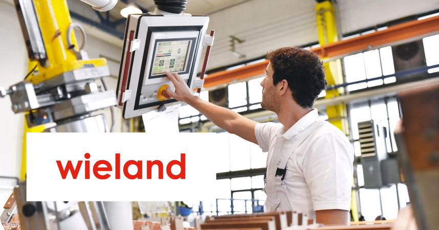 Man in a factory operates a touchscreen control panel. The word "wieland" is prominently displayed.