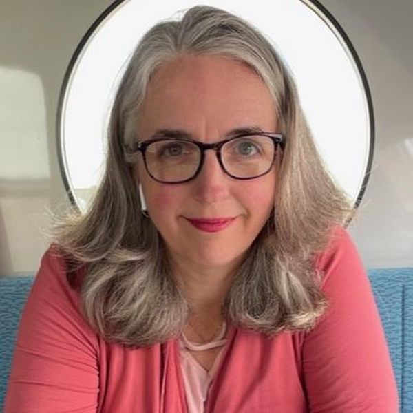 image of woman in pink shirt with glasses Karen Downs