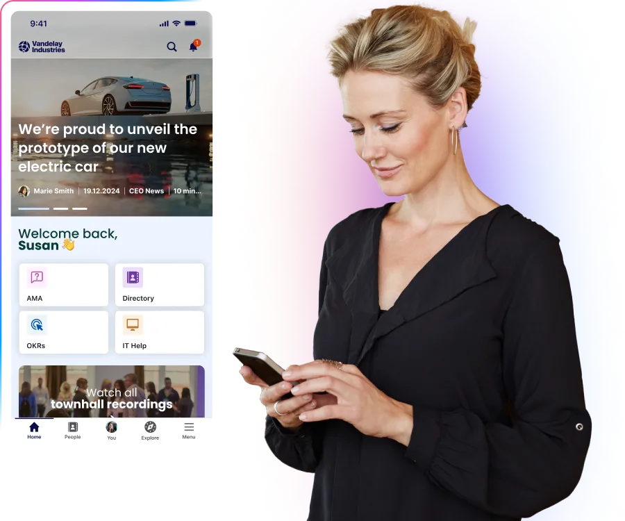 A woman in a black blouse uses a smartphone. Beside her is a mobile app interface showing company updates and a welcome message.