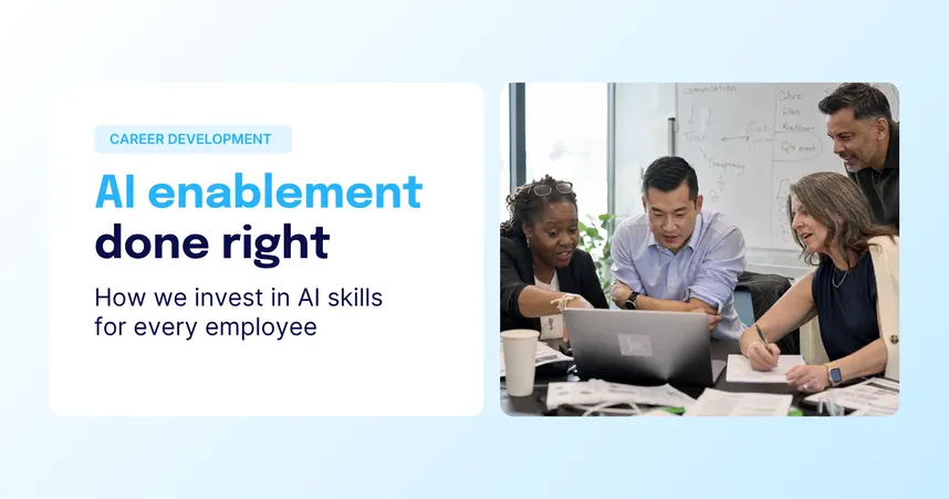 taffbase blog header titled "AI enablement done right: How we invest in AI skills for every employee," tagged Career Development, with four colleagues reviewing a laptop together.