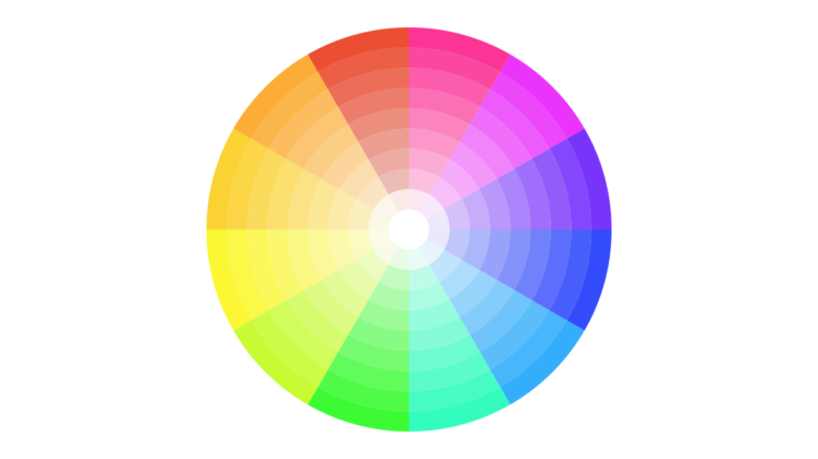 A circular color wheel displaying a full spectrum of colors arranged in segments, transitioning smoothly through red, pink, purple, blue, cyan, green, yellow, and orange. Colors become lighter toward the center.
