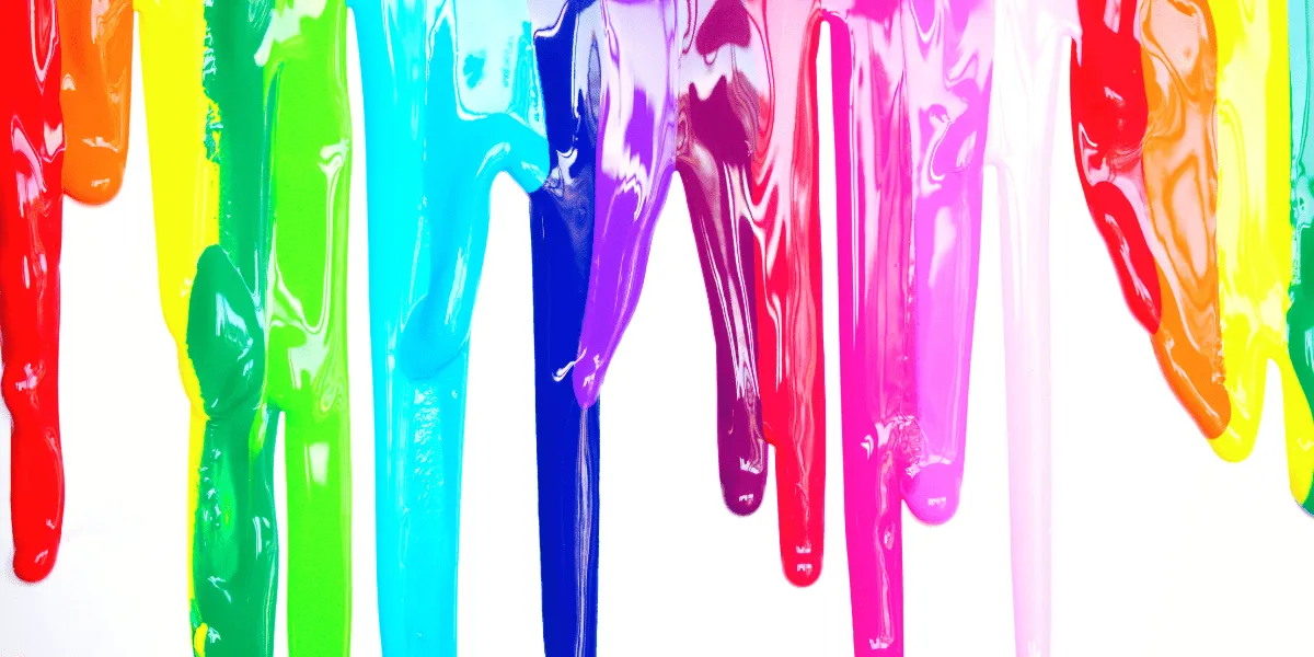 Vertical streaks of thick, glossy paint dripping down a white background in rainbow colors including red, orange, yellow, green, teal, blue, purple, and pink.