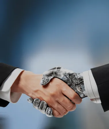 Human hand shaking a robotic hand