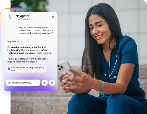 Smiling woman in scrubs using phone with AI assistant chat about warehouse training requirements displayed on screen.