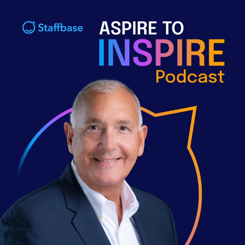 Smiling man in a suit against a dark blue background with "Aspire to Inspire Podcast" text and a colorful outline. Staffbase logo in the corner.