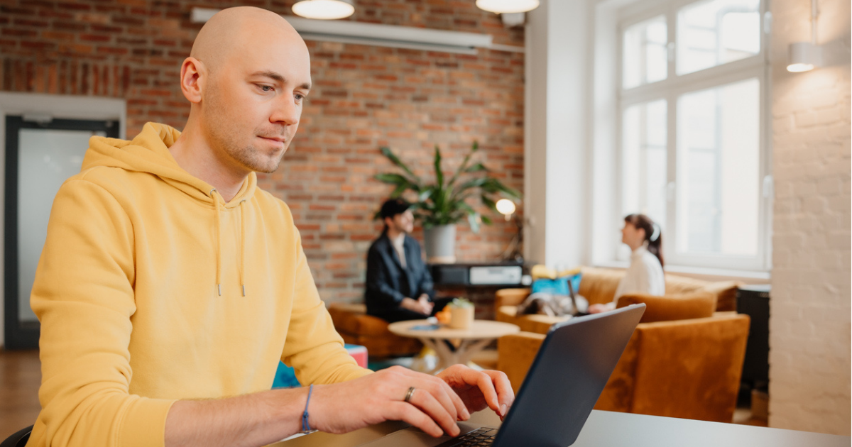 man working on laptop in office