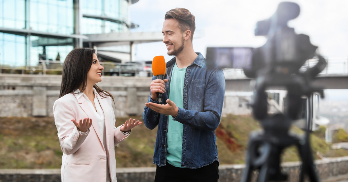 man interviewing woman