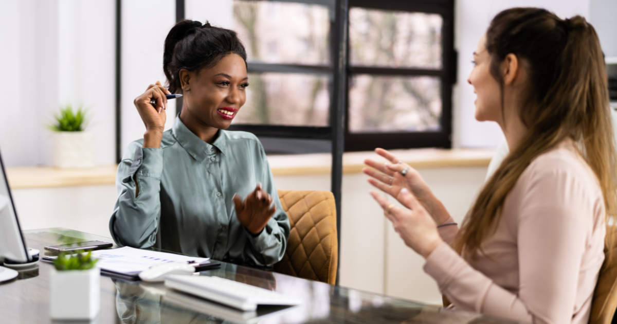 women talking at work