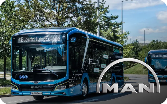 Electric bus branded #ElectrifyingEurope on a road, trees in background, with MAN logo in the foreground.