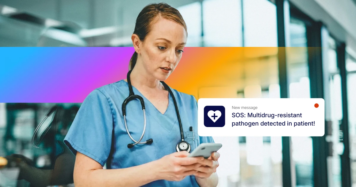 Healthcare worker in scrubs checking a smartphone while receiving an urgent alert reading “SOS: Multidrug-resistant pathogen detected in patient,” illustrating critical internal communication via employee app push notification.