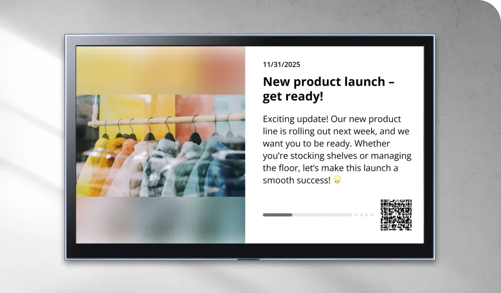 Digital screen displaying a new product launch announcement with colorful clothes on hangers and a QR code.