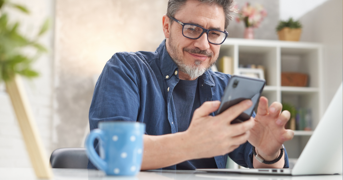 man on phone smiling