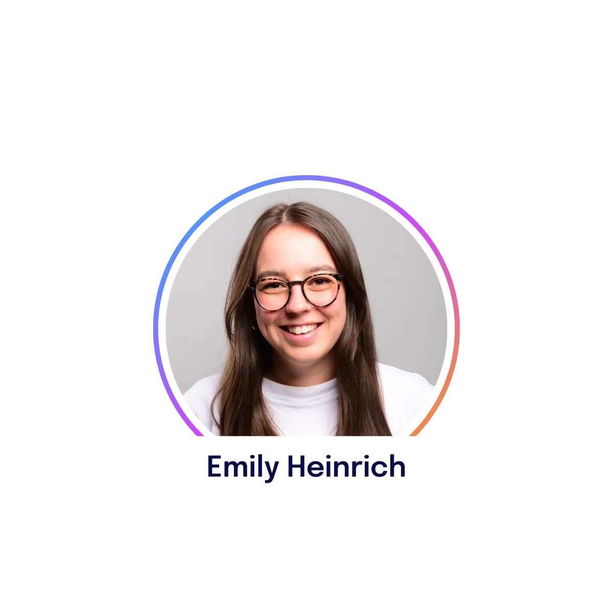 Smiling person with long hair and glasses, wearing a white shirt. Name tag reads "Emily Heinrich." Circular border with gradient colors.