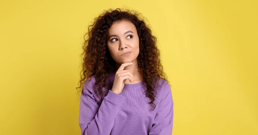 woman touching chin in thinking pose