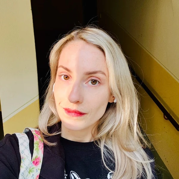 woman with blonde hair and black shirt