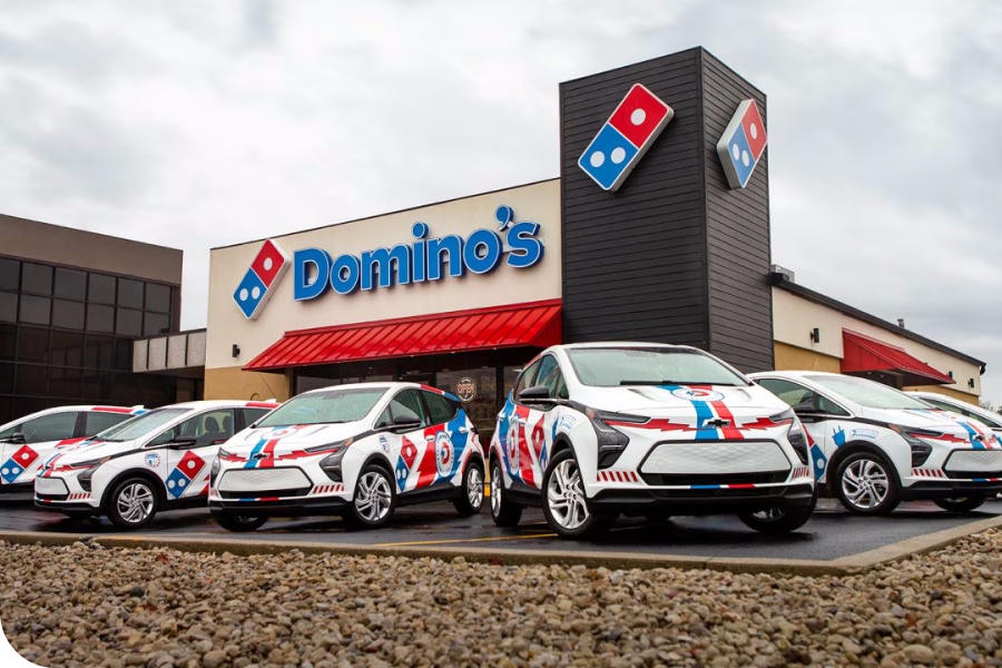 Cars in front of the Domino's pizza place