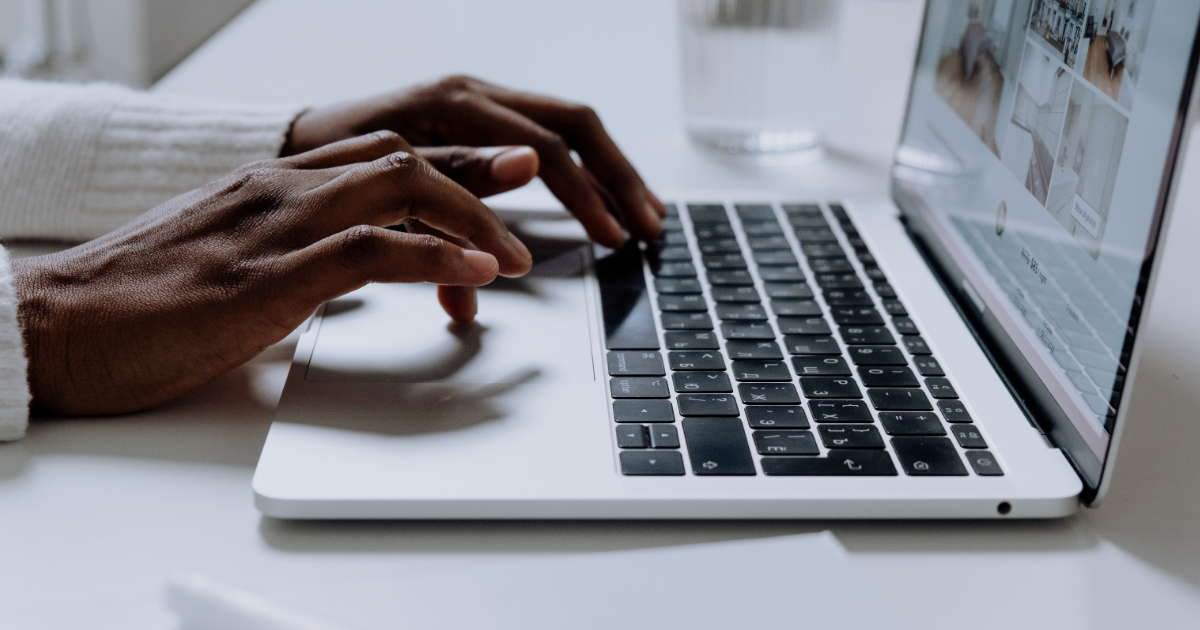 fingers typing on a keyboard