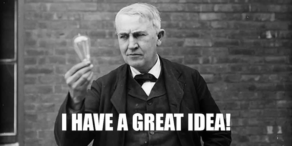 A man holds a lightbulb with the text