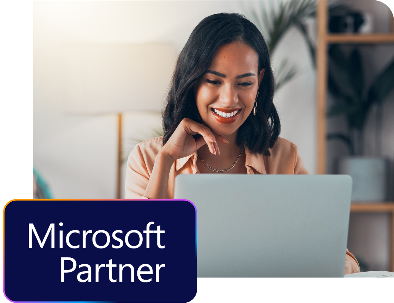 Smiling woman using a laptop, with a "Microsoft Partner" logo in the corner.