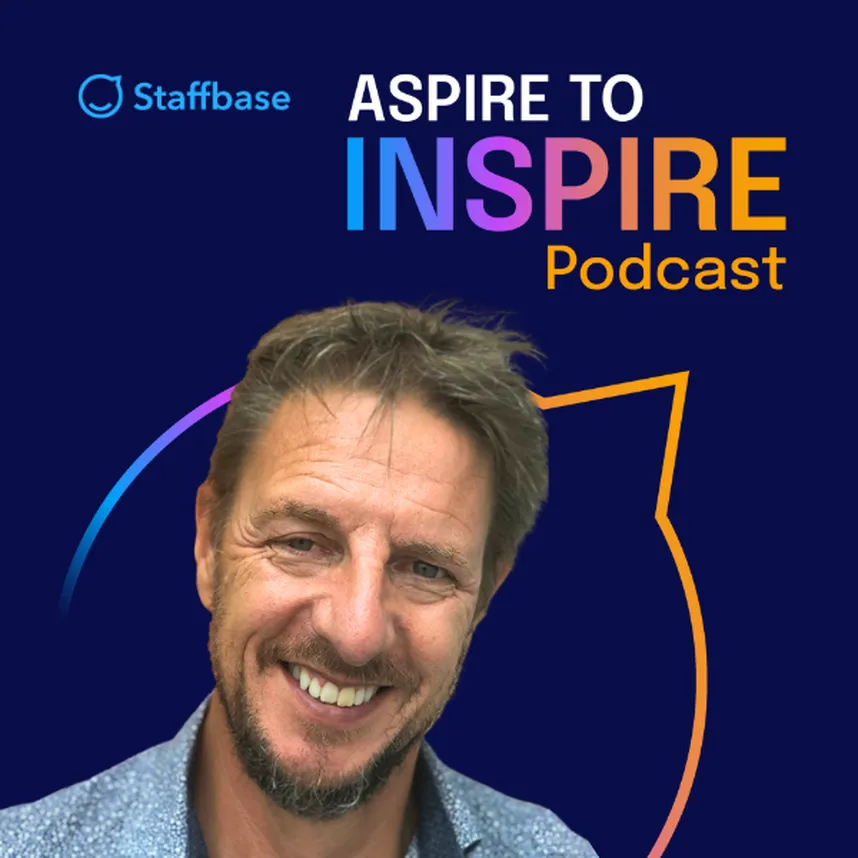 Smiling man in front of "Aspire to Inspire Podcast" logo with colorful text and Staffbase branding on a dark background.