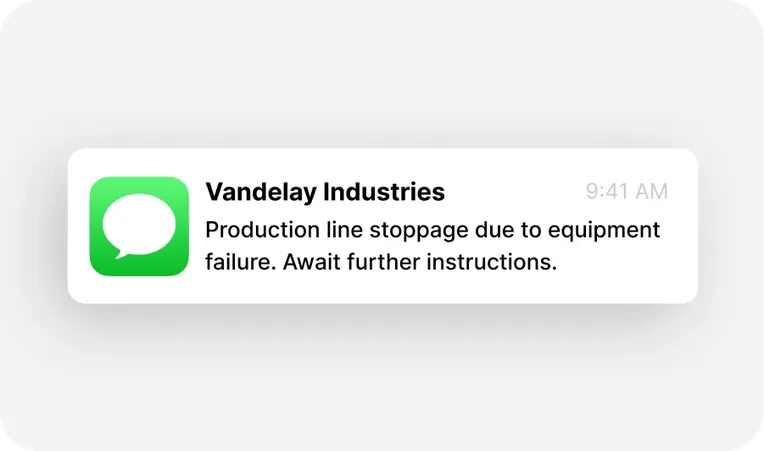 Text message notification from Vandelay Industries about a production line stoppage due to equipment failure, sent at 9:41 AM.