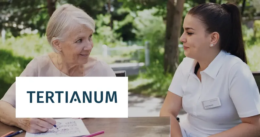 Elderly woman and caregiver sitting outdoors, smiling and talking. The caregiver is in a white uniform. Tertianum logo is visible.