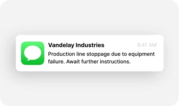 Text message notification from Vandelay Industries about a production line stoppage due to equipment failure, sent at 9:41 AM.