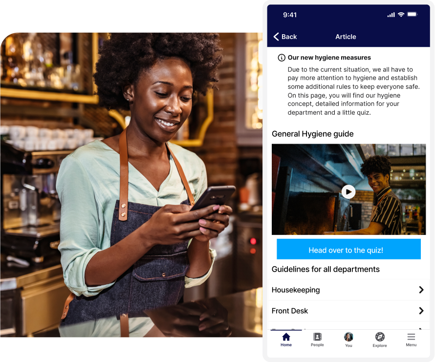 Smiling barista in an apron checks her phone; next to her is a mobile app screen showing hygiene measures and a quiz button.