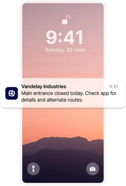 Smartphone lock screen showing a notification from Vandelay Industries about a closed entrance, with a pink-hued mountain landscape background.