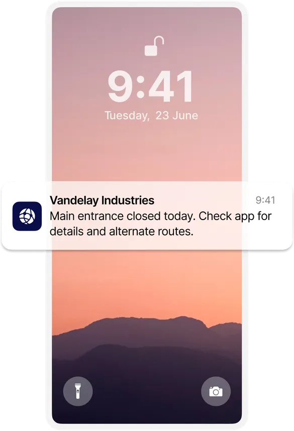 Smartphone lock screen showing a notification from Vandelay Industries about a closed entrance, with a pink-hued mountain landscape background.