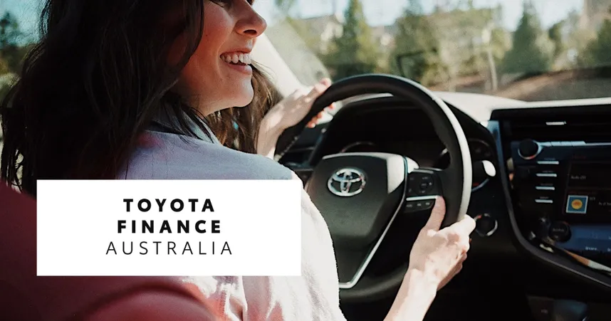 Smiling person driving a Toyota car with "Toyota Finance Australia" text overlay.