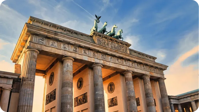 Brandenburg Gate in Berlin lit by golden sunset light, with the quadriga statue on top. Title: Brandenburg Gate at Sunset, Berlin