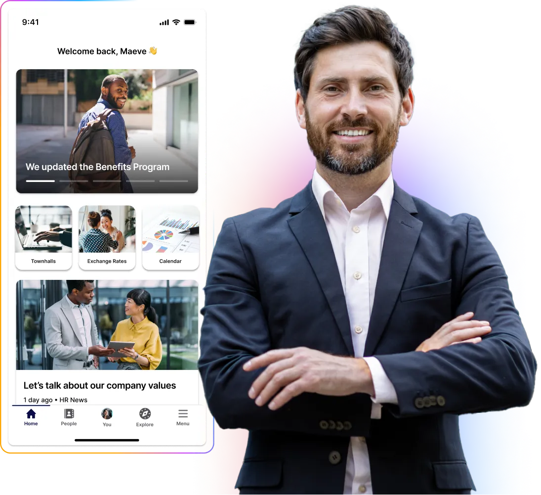 Smiling man in a suit stands with arms crossed beside a smartphone displaying a company app interface.