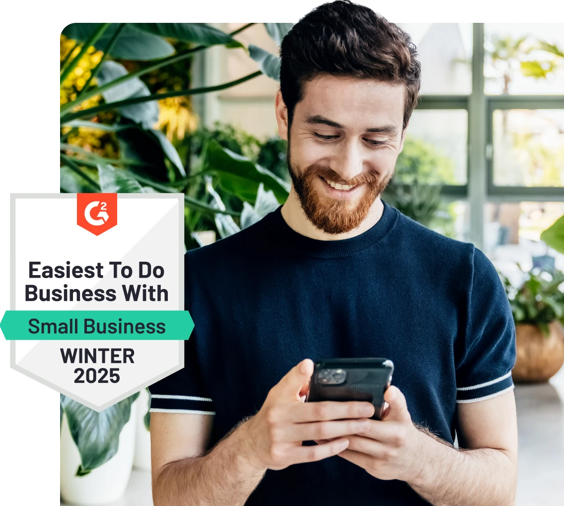 Man smiling at phone, standing near plants. Badge reads "Easiest To Do Business With, Small Business, Winter 2025."