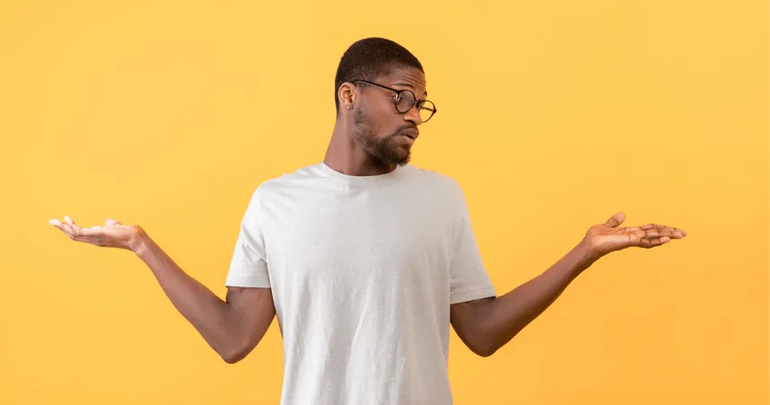 Man has confused expression and hands up